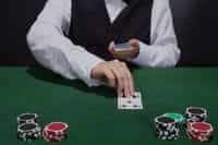 A dealer dealing a blackjack hand.