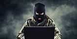 An image of a hacker wearing a balaclava.
