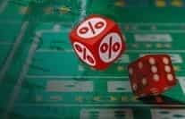 A craps payouts image showing dice with percentage signs on them.