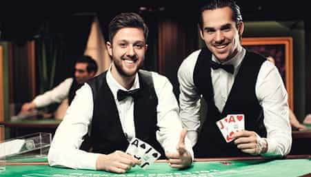 Two croupiers at a Visa Electron live casino.