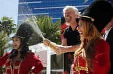 Branson celebrates with champagne at the announcement of the acquisition in Las Vegas.