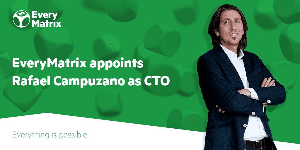 Rafael Campuzano standing next to a banner that reads "EveryMatrix appoints Rafael Campuzano as CTO.