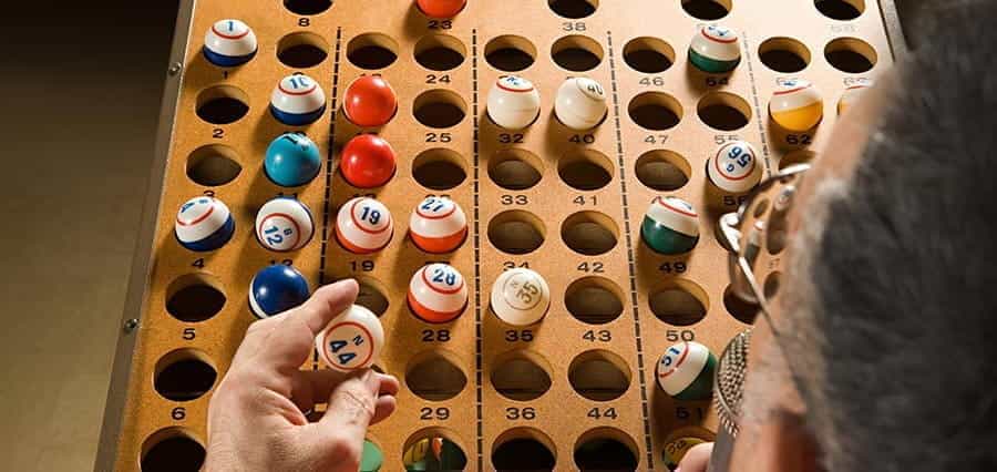 A bingo caller with bingo balls.