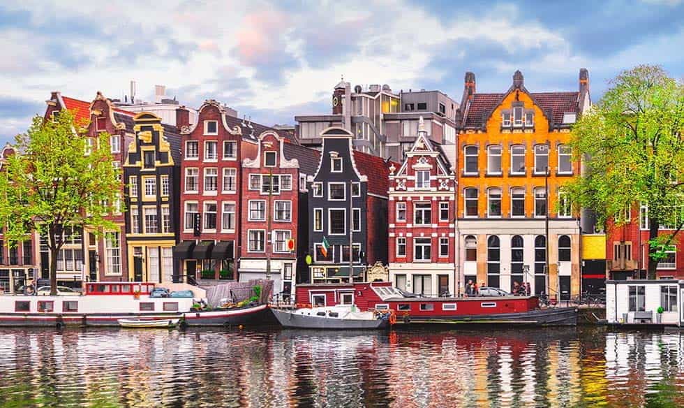 A row of houses in Amsterdam, seen over a canal.