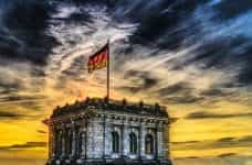A German flag atop the Reichstag building in Berlin.