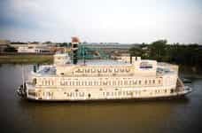The Belle of Baton Rouge, a large riverboat casino, docked afloat the Mississippi River.