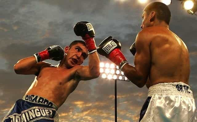 Two boxers fighting in the ring.