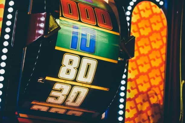 Closeup of a colorful roulette wheel in a casino.