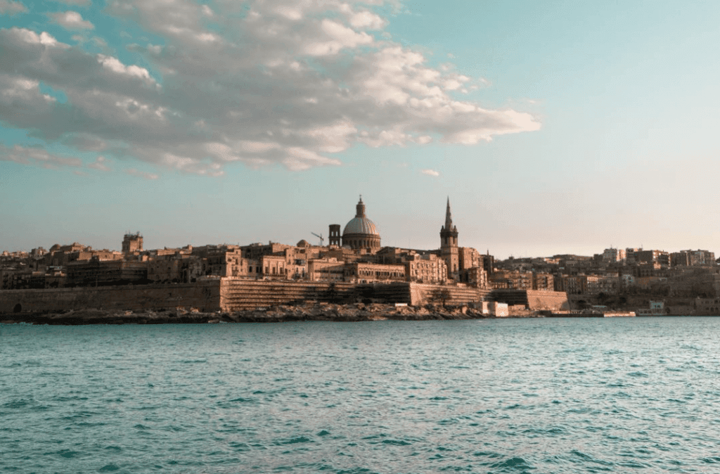 The island of Malta on a sunny day, as seen from the sea.