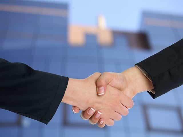 Business people shaking hands.