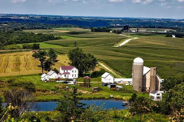 Farmland in Iowa with barn and silo.