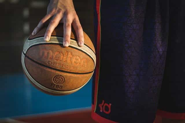 Man holding basketball.