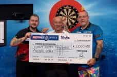 Dimitri Van den Bergh, Fred Done and Peter Wight holding a £33,000 charity check.