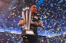 Gerwyn Price with the world championship trophy.