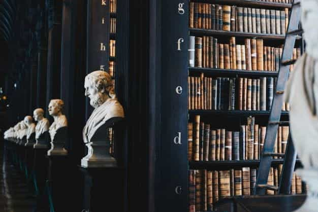 A law library features busts of famous thinkers.