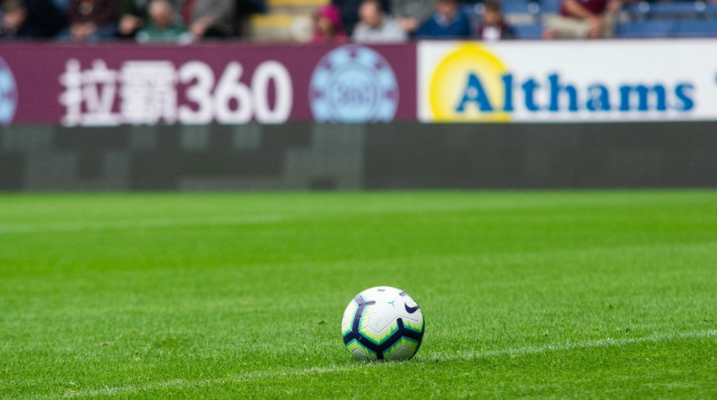 A Ball on a Football Pitch