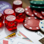 Pieces of Casino Gaming Equipment on a Wooden Table