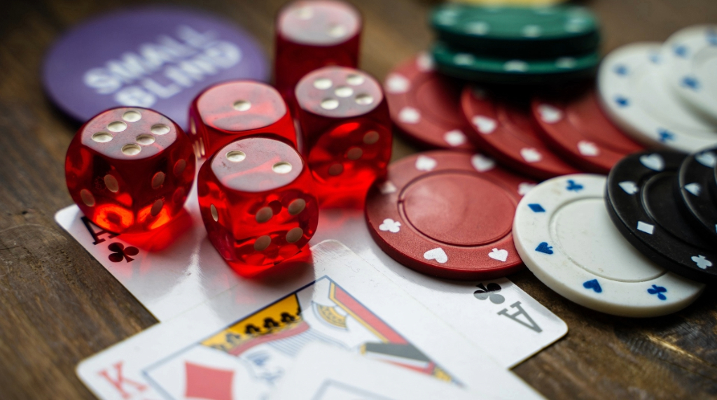 Pieces of Casino Gaming Equipment on a Wooden Table