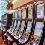 An Image of Slot Machines One Next to Another in a Casino