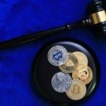 An Assortment of Crypto Coins and a Gavel