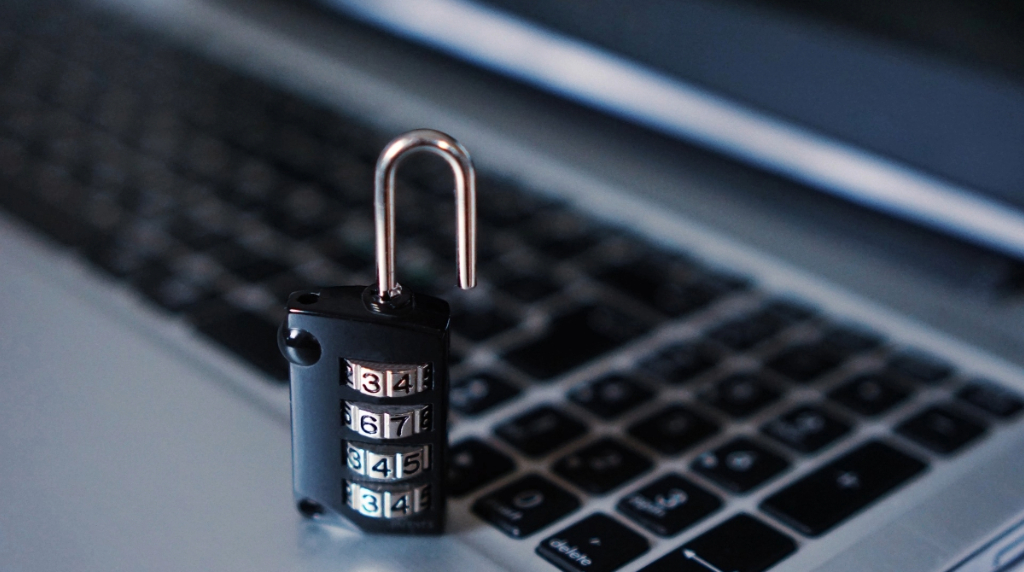 An Image Showing a Padlock by a Computer Keyboard