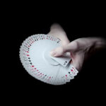 A Deck of Cards Being Spread in a Person’s Hands