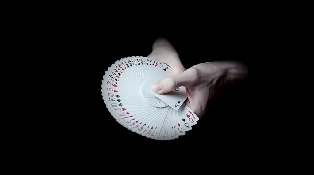 A Deck of Cards Being Spread in a Person’s Hands