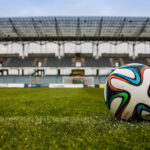 A Football Ball in an Empty Stadium