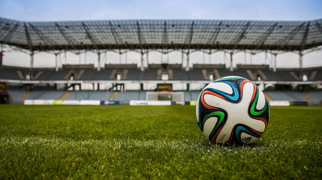 A Football Ball in an Empty Stadium