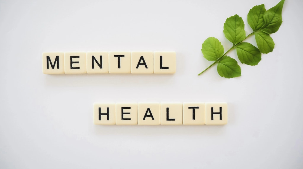 An Image Showing the Words Mental Health Spelled Out in Tiles