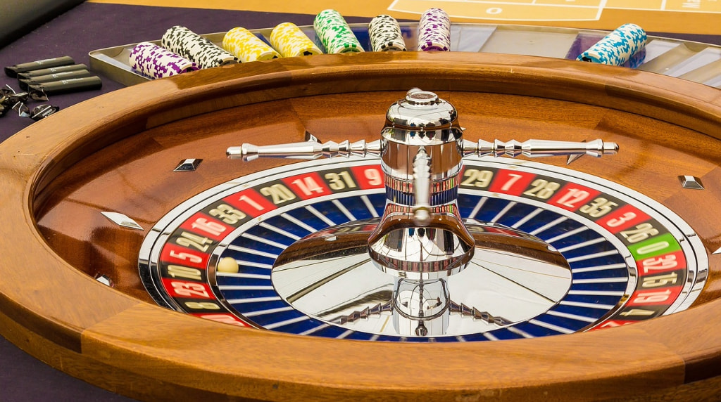 A Gaming Table With a Roulette Wheel