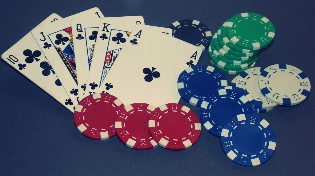 Poker Cards Showing a Royal Flush and Betting Chips