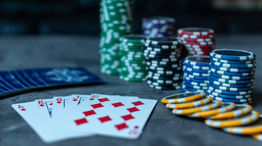 A Gaming Table With Poker Cards and Chips