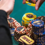 A Handsome Stack of Chips Before a Player at a Poker Table