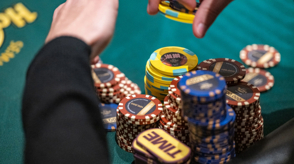 A Handsome Stack of Chips Before a Player at a Poker Table