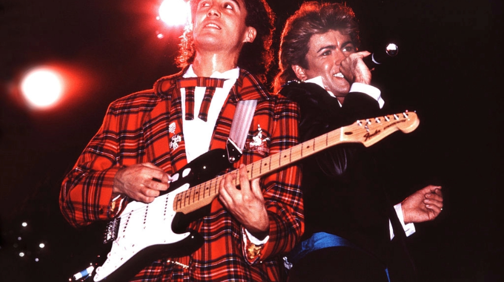 George Michael and Andrew Ridgeley performing on stage