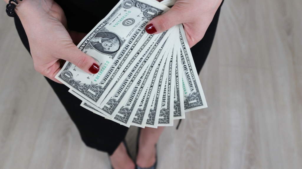 Woman Holding Banknotes