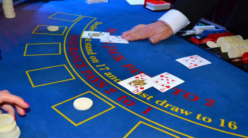 A Blackjack Table with Some Hands Dealt