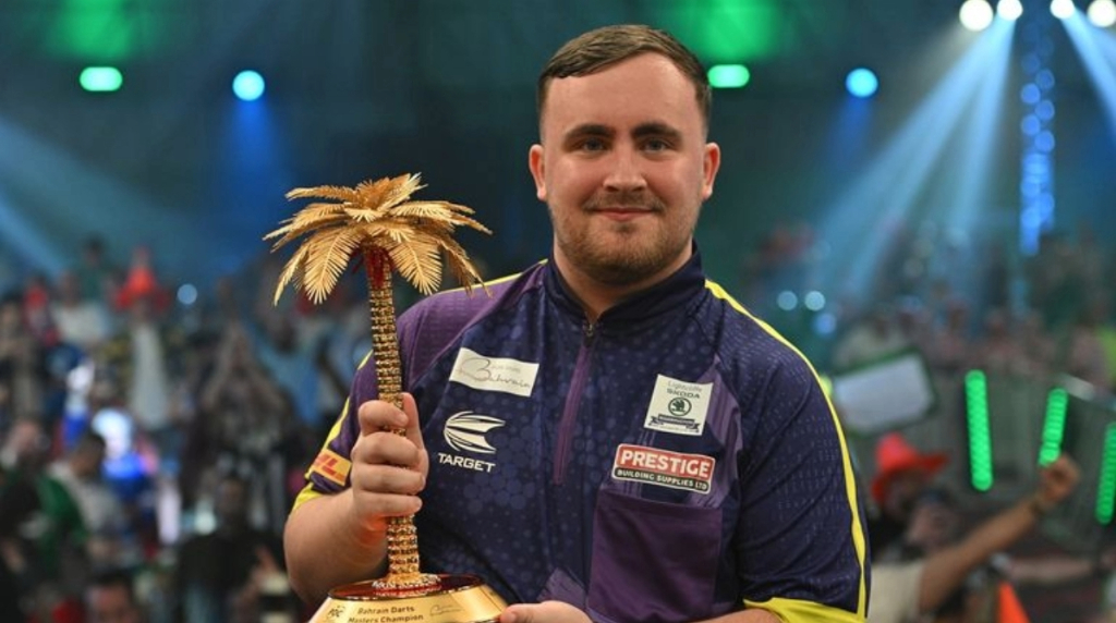 Luke Littler with the 2024 Bahrain Darts Masters Trophy.