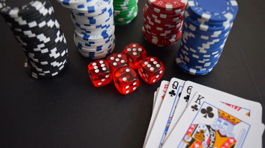 Dice, Cards and Poker Chips on a Table