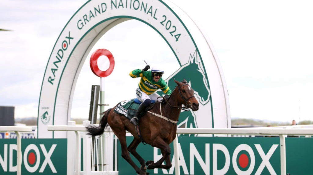 Paul Townend celebrates on board I Am Maximus as the pair win the 2024 Grand National.