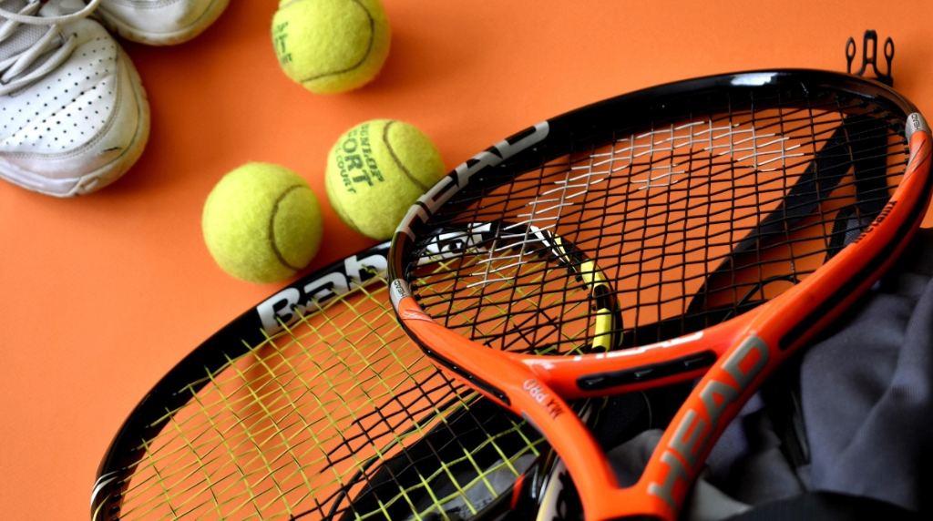 Tennis Racket and Balls on a Court