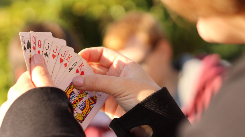 A player with a hand of cards