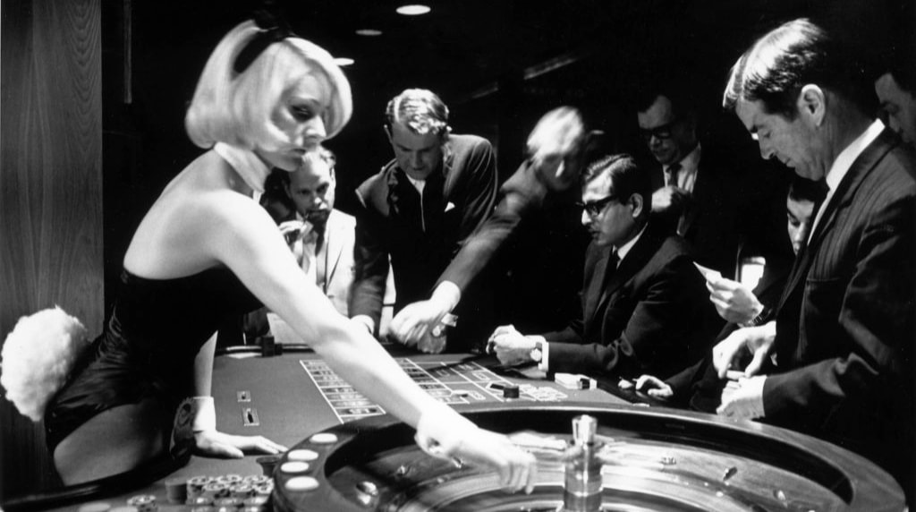 A Bunny Girl croupier spinning a roulette wheel in London's Playboy Club (1967)