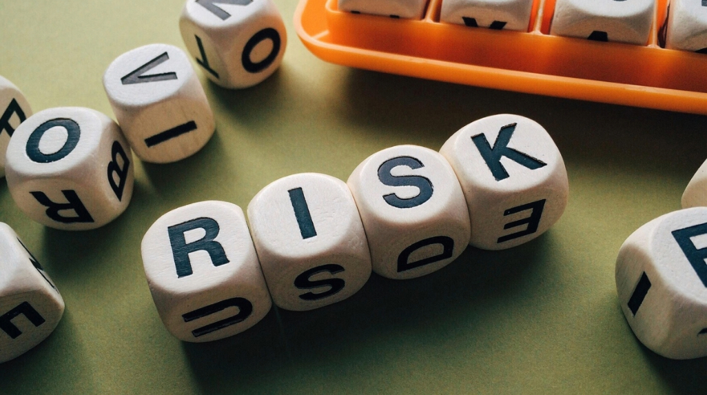 Dice with Letters Forming the Word Risk