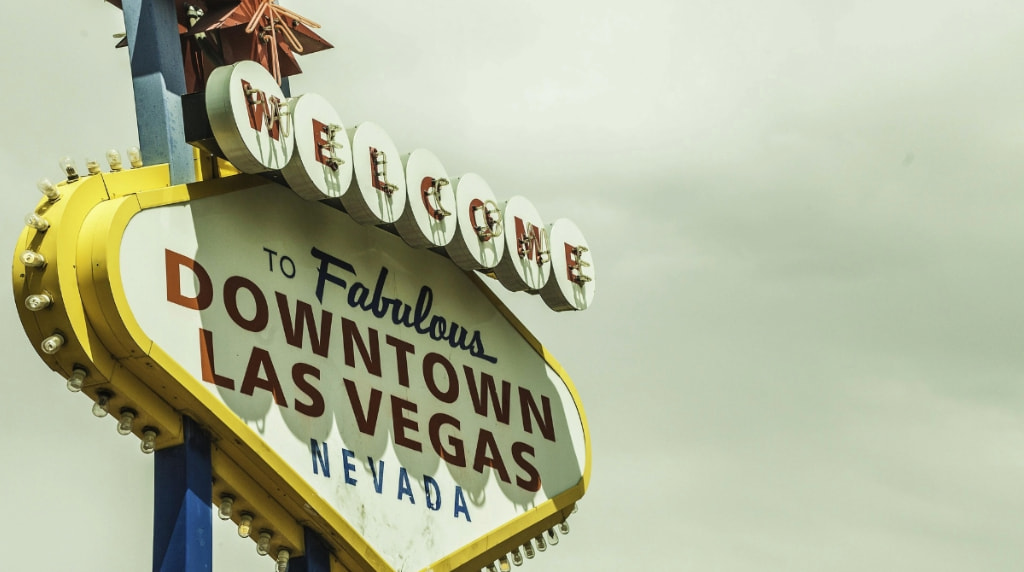 Welcome to Downtown Las Vegas sign against an overcast sky