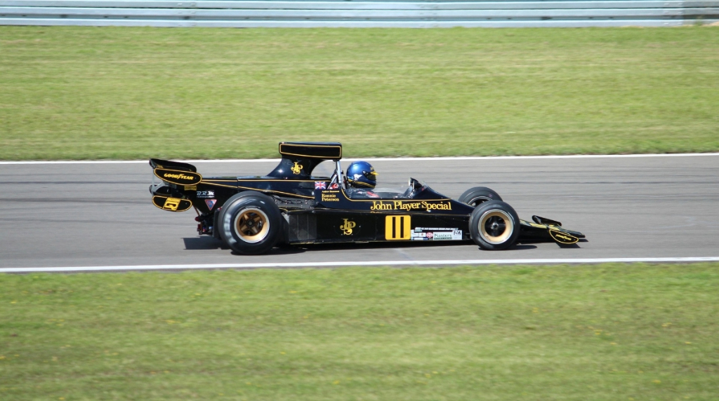 A Race Car Driving Around a Track at High Speed