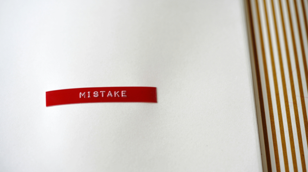 The Word Mistake on a Piece of White Paper