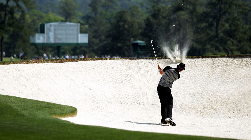 Rory McIlroy hits from the bunker on the second hole during the final round of the 2011 Masters.